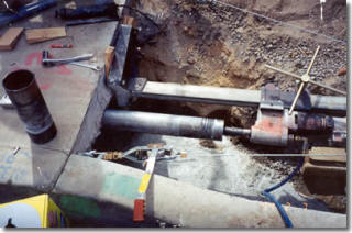 Core drill boring through the concrete deck on the 91 freeway bridge job